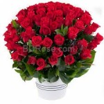 Round Basket of 50 Red Roses
